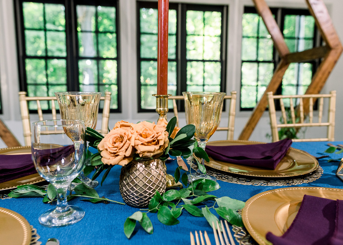Wedding tablescape with blue and gold
