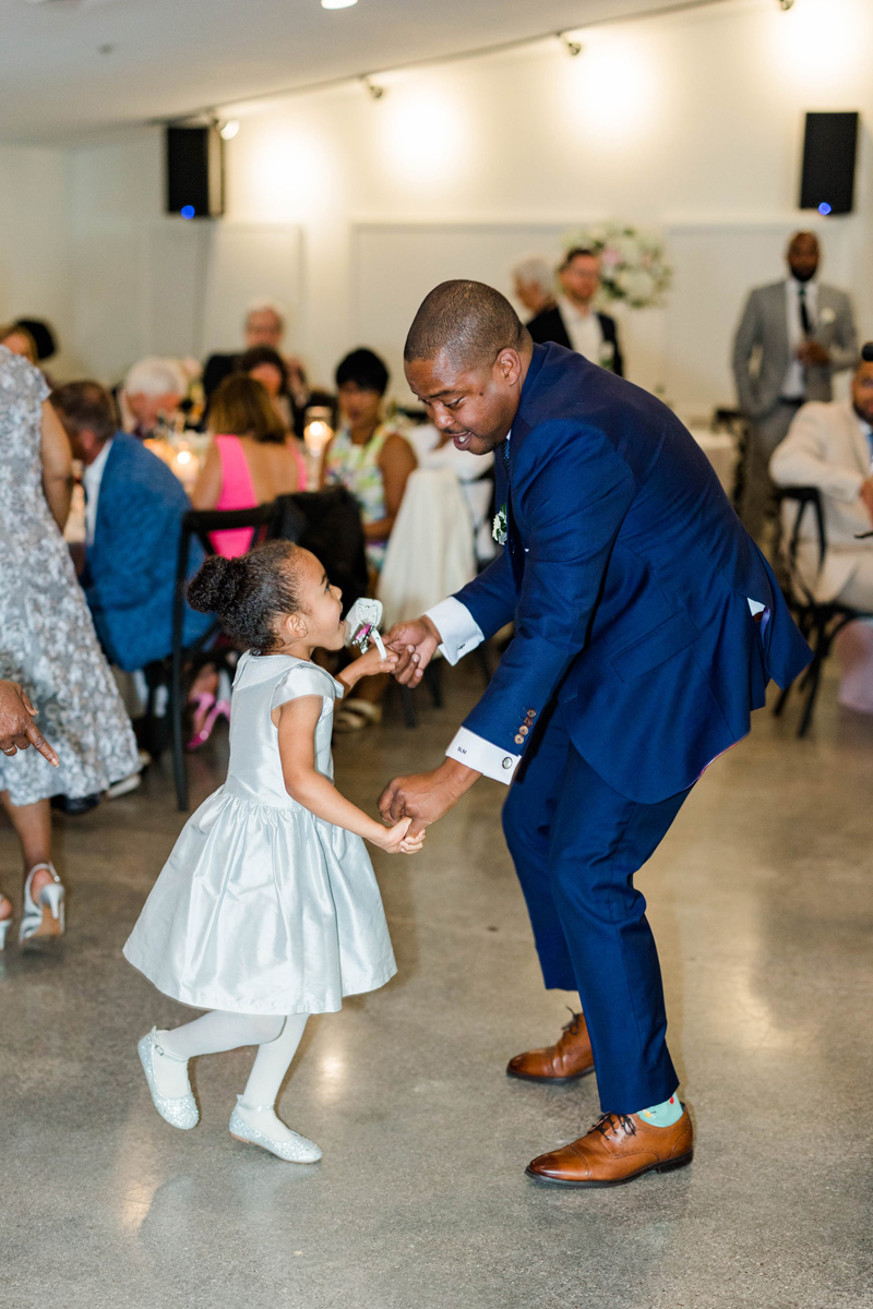 groom and young girl dancing