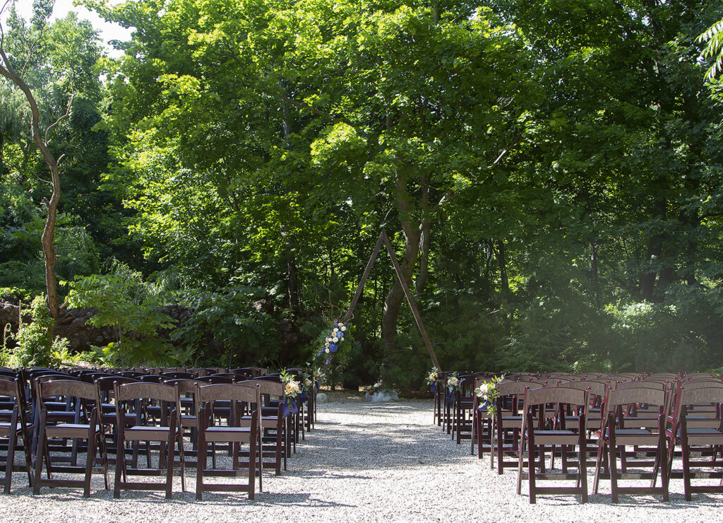 Ceremony set up in the back wooded area of South Haven Creations 