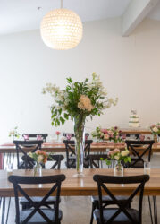 walnut tables with tall flower vase