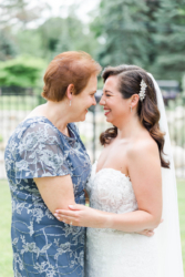 bride and mother on the front lawn