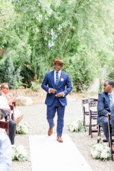 groom walking down isle