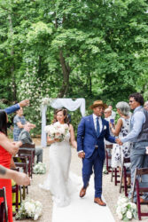 couple just married walking down isle